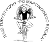 Rowerzysta z olbrzymim rogalem na ramionach