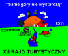 Logo rajdu Rower, kajak i namiot na tle zachodzącego słońca